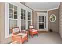 Relaxing front porch with comfortable seating, creating a welcoming outdoor space at 524 Clarenbridge Dr, Cary, NC 27519
