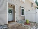Inviting front entrance featuring a wreath and well-maintained landscaping around the walkway at 7408 Sandy Creek Dr, Raleigh, NC 27615