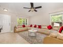 Inviting living room with a ceiling fan, a large window, and comfortable L-shaped seating at 776 Averasboro Dr, Clayton, NC 27520