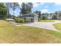 Backyard with upper deck, parking area, and some landscaping at 103 Rex Pl, Louisburg, NC 27549