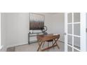 Bright, minimalist office space featuring natural light, a modern desk setup, and serene decor, perfect for productivity at 108 Reagan Crest Dr, Clayton, NC 27520