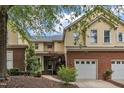 Charming two-story home featuring a brick foundation and attached two-car garage at 11035 Southwalk Ln, Raleigh, NC 27614