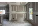 Bright dining area featuring large windows and open to the kitchen, perfect for entertaining and Gathering meals at 240 Green Pines Estates Dr, Kenly, NC 27542