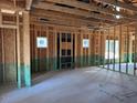 View of an unfinished living space, showing framing and some wall coverings at 240 Green Pines Estates Dr, Kenly, NC 27542