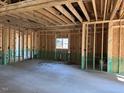 Interior view of an unfinished room, showing framing and concrete floor at 240 Green Pines Estates Dr, Kenly, NC 27542