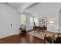 Bright office space featuring hardwood floors, a large window, and stylish furniture; ideal for remote work at 109 Highland Mist Cir, Apex, NC 27539
