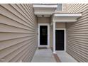 Home entrance showcasing units 112 and 114, with neutral siding and covered front porch at 114 Montview Way, Knightdale, NC 27545