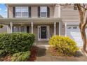 Close up of the front porch with decorative plants and hanging baskets at 126 Thimbleweed Ln, Lillington, NC 27546