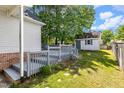 Backyard featuring a spacious deck, shed, and lush greenery, perfect for relaxation and outdoor activities at 1732 Bobwhite Ln, Rocky Mount, NC 27804