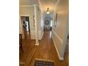 Inviting hallway with hardwood floors and decorative lighting at 2833 Praire View Pt, Wendell, NC 27591