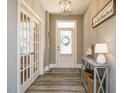 Elegant foyer with hardwood floors and stylish decor, creating a welcoming entrance at 2909 Thurman Dairy Loop, Wake Forest, NC 27587