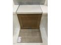 Neutral design palette displaying brown cabinets and quartz countertops with light wood luxury vinyl flooring at 332 White Oak Garden Way # 221, Garner, NC 27529