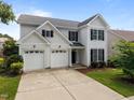 Charming two-story home with a two-car garage, complemented by a well-manicured lawn and tidy landscaping at 333 Trout Valley Rd, Wake Forest, NC 27587