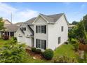 Well-maintained two-story home featuring a two-car garage, landscaping, and trimmed lawn at 333 Trout Valley Rd, Wake Forest, NC 27587