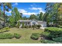 Well-maintained single-story home with mature trees and beautiful landscaping for added curb appeal at 345 Kinsman Ct, Fuquay Varina, NC 27526
