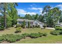 Attractive single-story home featuring manicured landscaping and a welcoming front yard at 345 Kinsman Ct, Fuquay Varina, NC 27526