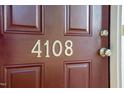 Close-up of front door with the house number displayed, showcasing a welcoming entryway at 4108 Lady Slipper Ln, Durham, NC 27704