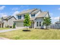 Two-story home with a two car garage, front lawn and fresh landscaping at 51 Duchess Ave, Franklinton, NC 27525