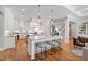 Open gourmet kitchen features double islands and stainless steel appliances at 6 Castlewood Dr, Durham, NC 27713