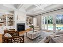 Bright living room with fireplace, built-ins, and access to the backyard at 6 Castlewood Dr, Durham, NC 27713