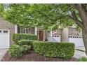 Well-maintained brick home with manicured hedges and a welcoming covered entryway at 625 Canvas Dr, Wake Forest, NC 27587