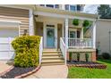 Close up of front porch with beautiful plants and welcome wreath at 8613 Swarthmore Dr, Raleigh, NC 27615
