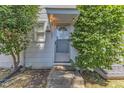 Charming entrance with white trim, a glass-paned door, and a small welcome mat at 917 Saint Marys St, Raleigh, NC 27605