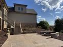 Stone patio with a built-in fire pit and backyard access at 976 Knob Hill Dr., Hillsborough, NC 27278