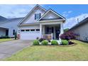 Well maintained single-Gathering home with an attached garage and landscaped front yard at 1033 Cuthbert Ln, Durham, NC 27703