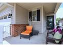 Cozy front porch with seating, offering a relaxing outdoor space at 1033 Cuthbert Ln, Durham, NC 27703