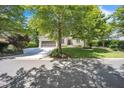 Charming house with mature shade trees, lush lawn and a spacious driveway at 1225 Fanning Dr, Wake Forest, NC 27587