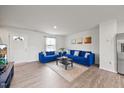 Spacious living room with hardwood floors, leading to the entryway at 1303 Bent Willow Dr, Durham, NC 27704