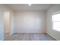 Bright and spacious living space with modern wood-look flooring and natural light at 1730 Pie Filling Dr, Haw River, NC 27258