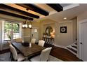 Dining room with a rustic wood table, bright lighting, and wood flooring at 211 George Hudson Rd, Siler City, NC 27344