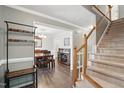 Inviting entryway with hardwood floors, staircase, and dining room access at 215 Rocky Point Ct, Fuquay Varina, NC 27526