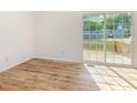Bright and airy living room with lots of light and a sliding door to the deck at 2670 Nc 210 S, Lillington, NC 27546