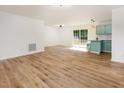 Inviting living area with open floor plan with lots of natural light and new flooring at 2670 Nc 210 S, Lillington, NC 27546