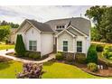 Attractive single-story home featuring stone accents and manicured landscaping at 2910 Reynolda Cir, Durham, NC 27712