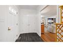 Bright entryway with stone flooring and view into the living room at 3028 Rothgeb Dr, Raleigh, NC 27609