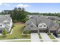 Wide aerial shot of a residential community featuring orderly streets and verdant green spaces at 3406 Antler View Dr, Apex, NC 27502