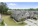 Aerial view of a well-planned neighborhood showcasing homes with manicured lawns and mature trees at 3406 Antler View Dr, Apex, NC 27502