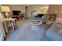 Relaxing living room features neutral carpet, two sofas, and a decorative coffee table at 3523 Ivy Commons Dr # 102, Raleigh, NC 27606