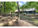 Beautiful backyard with fire pit and bench seating, perfect for outdoor entertaining and relaxation at 4022 Tecolote Way, Hillsborough, NC 27278