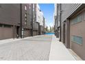 Exterior view of an alley with a row of garages in a modern townhome community at 512 Gordon St # 1006, Durham, NC 27701