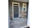 Close-up of the front door with stone trim and clear numbering for easy identification at 5122 Jessip St, Morrisville, NC 27560