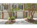 Inviting townhome featuring a one car garage and walkway leading to the front door at 5310 Echo Ridge Rd, Raleigh, NC 27612