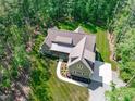 Aerial view showcasing the home's roof, landscaping, and surroundings at 59 Mill Rd, Pittsboro, NC 27312