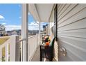 Relax on the covered front porch with comfortable seating and enjoy views of the neighborhood at 59 Nevada Ct, Clayton, NC 27527