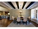 Open-concept dining area with stylish furnishings, hardwood floors, and easy access to the kitchen at 6104 Hope Farm Ln # 18, Wake Forest, NC 27587