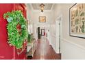 Bright foyer with hardwood floors, decor, and views to the front door at 7227 Cleveland Rd Rd, Clayton, NC 27520